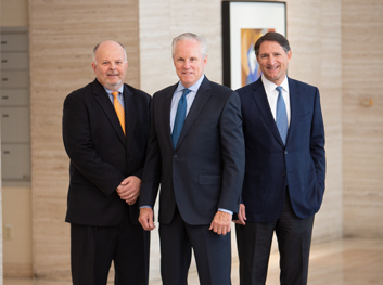 leadership at Champion Partners Commercial Real Estate investors and investing three older business men in suit and ties